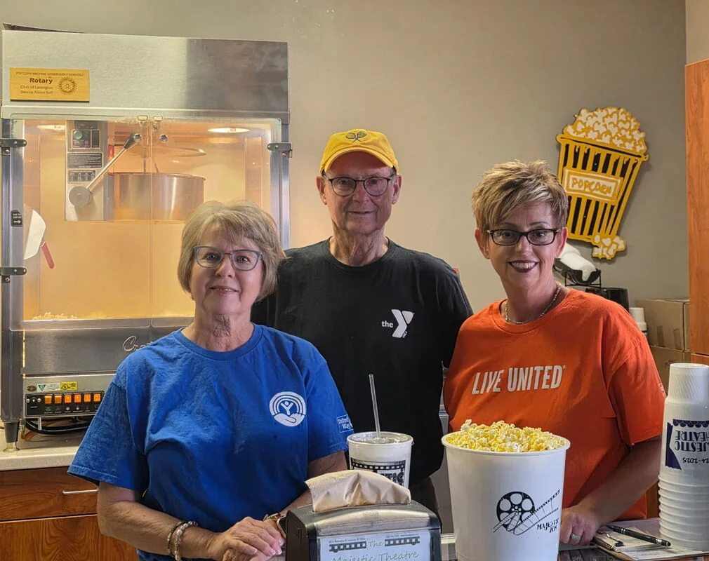 United Way volunteers serving popcorn and drinks at the Majestic